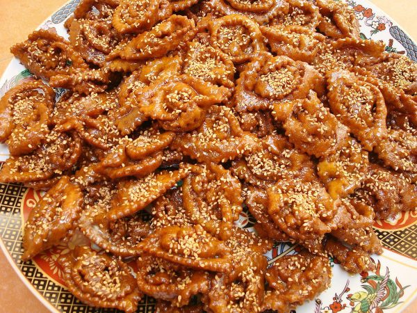Another delicious dessert, shebakia is a flower-shaped, fried sesame cookie dipped in honey. You’ll usually find bees all over them in the markets, and they just shoo them away before serving them to you. It’s all part of the experience.