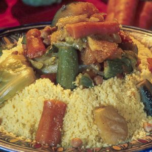 The main Moroccan dish people are most familiar with is couscous; beef is the most commonly eaten red meat in Morocco, usually eaten in a tagine with a wide selection of vegetables. Chicken is also very commonly used in tagines or roasted. They also use additional ingredients such as plums, boiled eggs, and lemon.